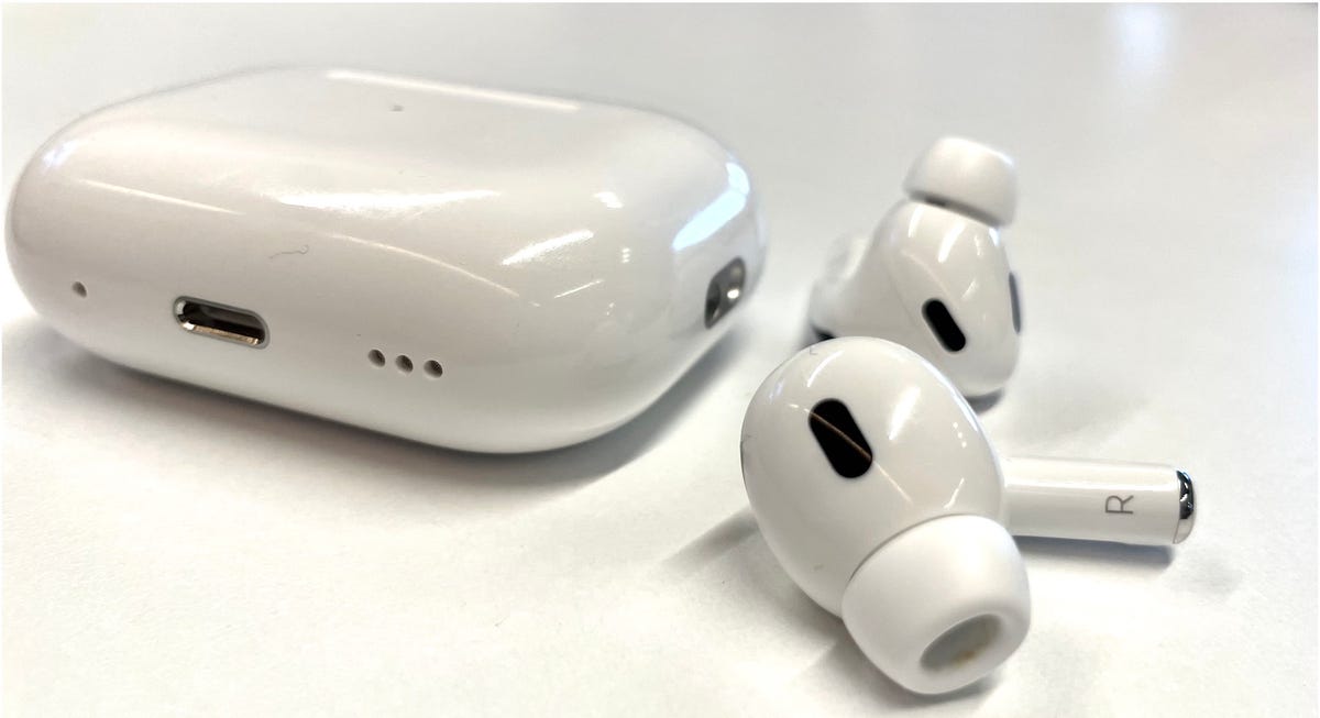 AirPods Pro 2 case full view with the headphones showing the sensors